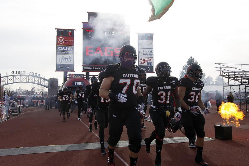 TJ Lee leads the Eagles on to the field during his senior season. 
