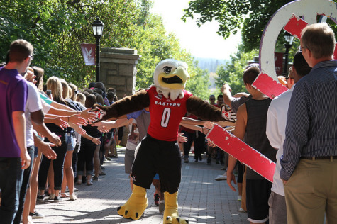 Swoop, EWU mascot, leads new students toward Showalter Hall at the Passing Through The Pillars event on Sept. 22