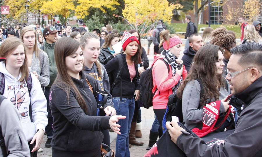 Students exchange T-shirts in celebration of the EWU Homecoming kickoff event on Oct. 27.