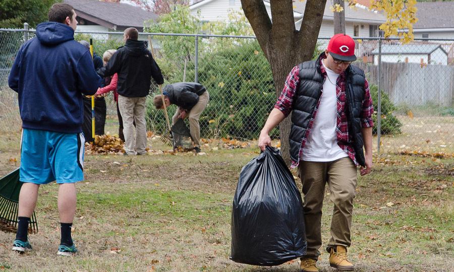 Hector Zavala, an EWU Freshman and member of Beta Theta Pi, volunteers at the Rake a Difference event on Oct. 28