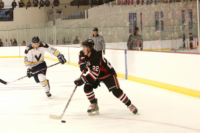 Paxton Bell moving the puck down the ice in the game against the University of Victoria.