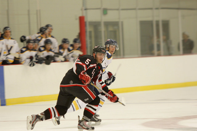 Josh Rolfe races a University of Victoria player down the ice.
