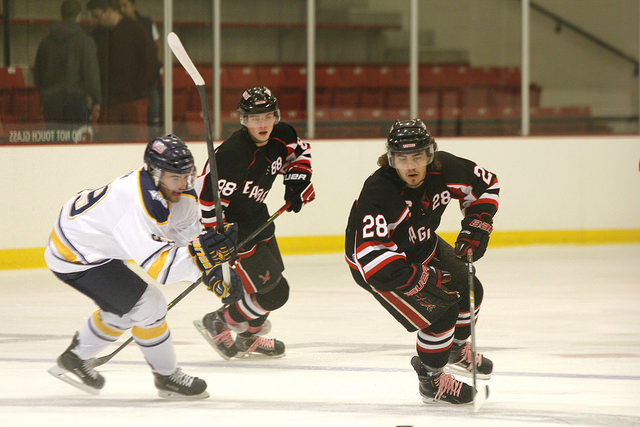Chase Wharton chasing after the puck in the game against the University of Victoria.