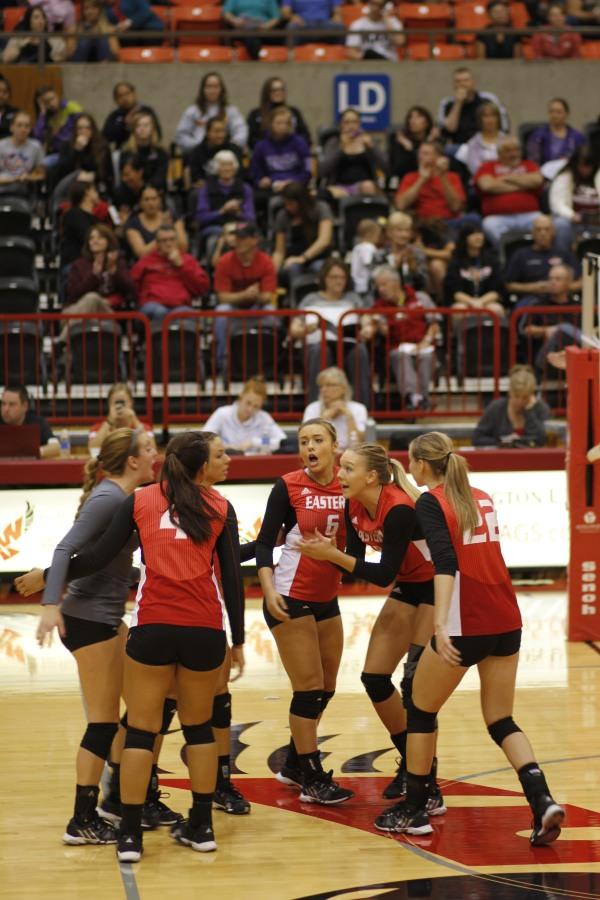 The volleyball team celebrates after they score a point during the game against Idaho.
