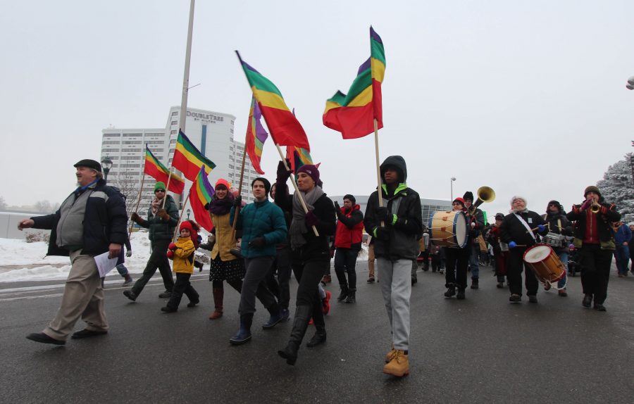 Crowds of people walk through the streets of downtown Spokane for the annual MLK Day march.