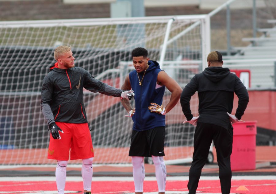 (Left to right) Wide receivers Cooper Kupp, Kendrick Bourne and Shaq Hill talk during the wide receiver field drills.