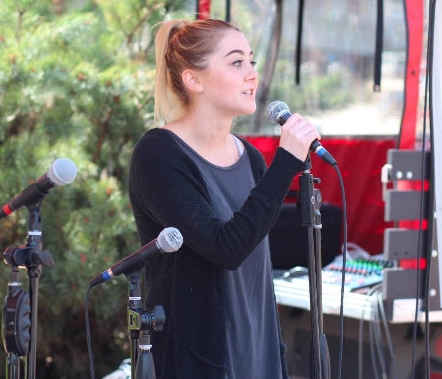 Ashley Jenniges, ASEWU student activities representative candidate, addresses the audience at the Campus Mall. 