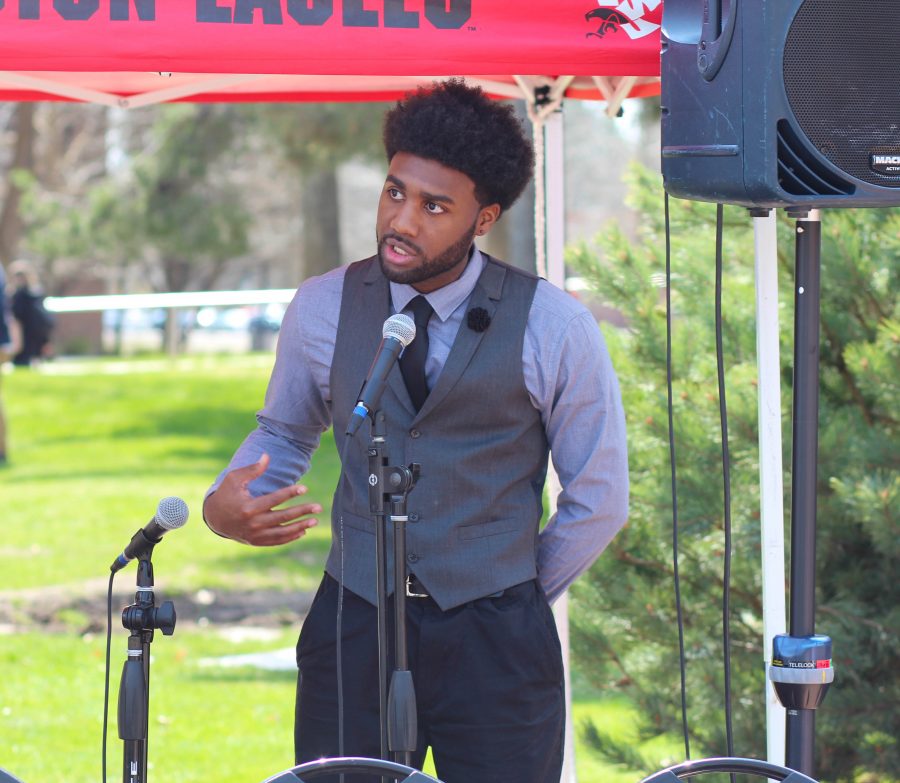 Jevion Knox, ASEWU academic affairs representative candidate, addresses the audience at the Campus Mall. 