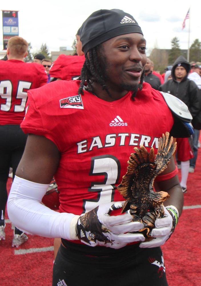 The games MVP Brandon Montgomery holding the Golden Eagle trophy, at the Red-White spring game. 