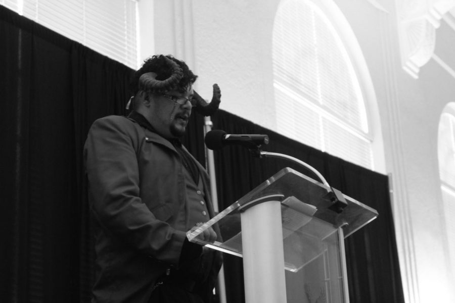 Remijo C. Mendoza delivers his story Teifling to the crowd in Hargreaves Hall Friday. A story slam is similar to a poetry slam where writers recount events from their lives that impacted who they are today | McKenzie Ford for The Easterner