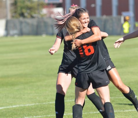 Senior Alexis Stephenson (18) embraces senior Devan Talley during EWUs 8-1 senior day win over Idaho State. With the victory on Sunday, the Eagles improved to sixth in the six-team playoff race with two weekends remaining before the conference tournament. | Bailey Monteith for The Easterner