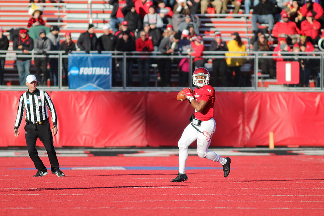 Sophomore QB Eric Barriere scans the defense before throwing a pass in the first half against Maine.  Barriere finished the game with seven touchdown passes, tying a school record set by Vernon Adams in 2014.