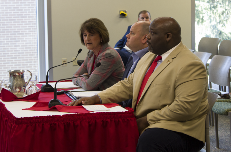 Athletic director Lynn Hickey and senior associate athletics director for external affairs Devon Thomas sit in front of the board of trustees on Friday. The BOT approved Hickeys decision to postpone the Roos Field renovation proposal until another meeting in October. This meeting occurred in 2019.