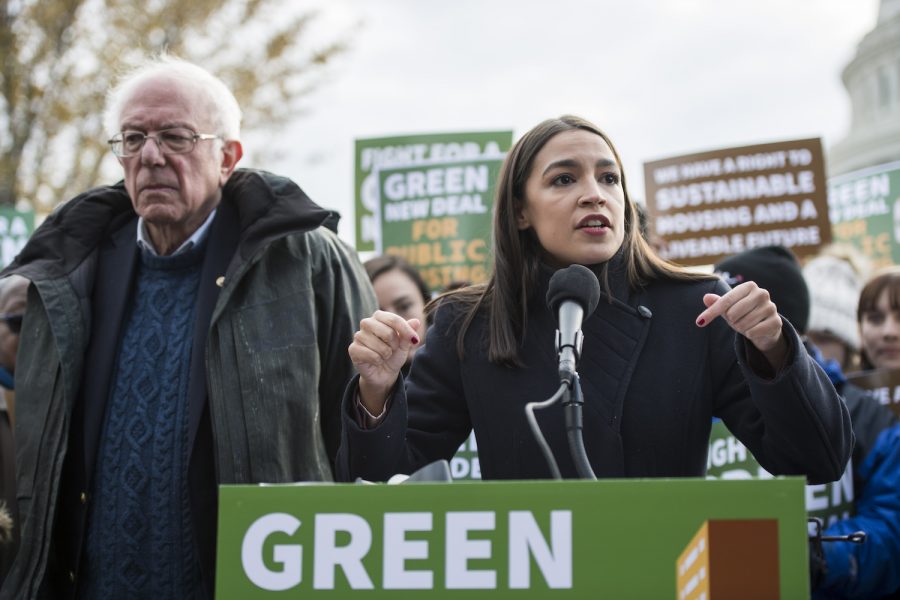 UNITED STATES - NOVEMBER 14: Sen. Bernie Sanders, D-Vt., and Rep. Alexandria Ocasio-Cortez, D-N.Y., along with affordable housing advocates and climate change activists announce the introduction of public housing legislation as part of the Green New Deal outside the Capitol on Thursday, November 14, 2019. (Photo By Bill Clark/CQ-Roll Call, Inc via Getty Images)