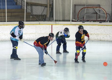 Broomball is similar to hockey except it is played with shoes and a broom.