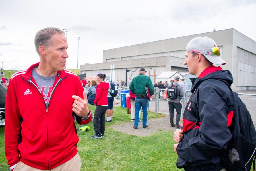 Don Schaplow (left) and Duke Schaplow (right) take a moment to discuss as the Boy’s Javelin event is in progress Saturday afternoon.
