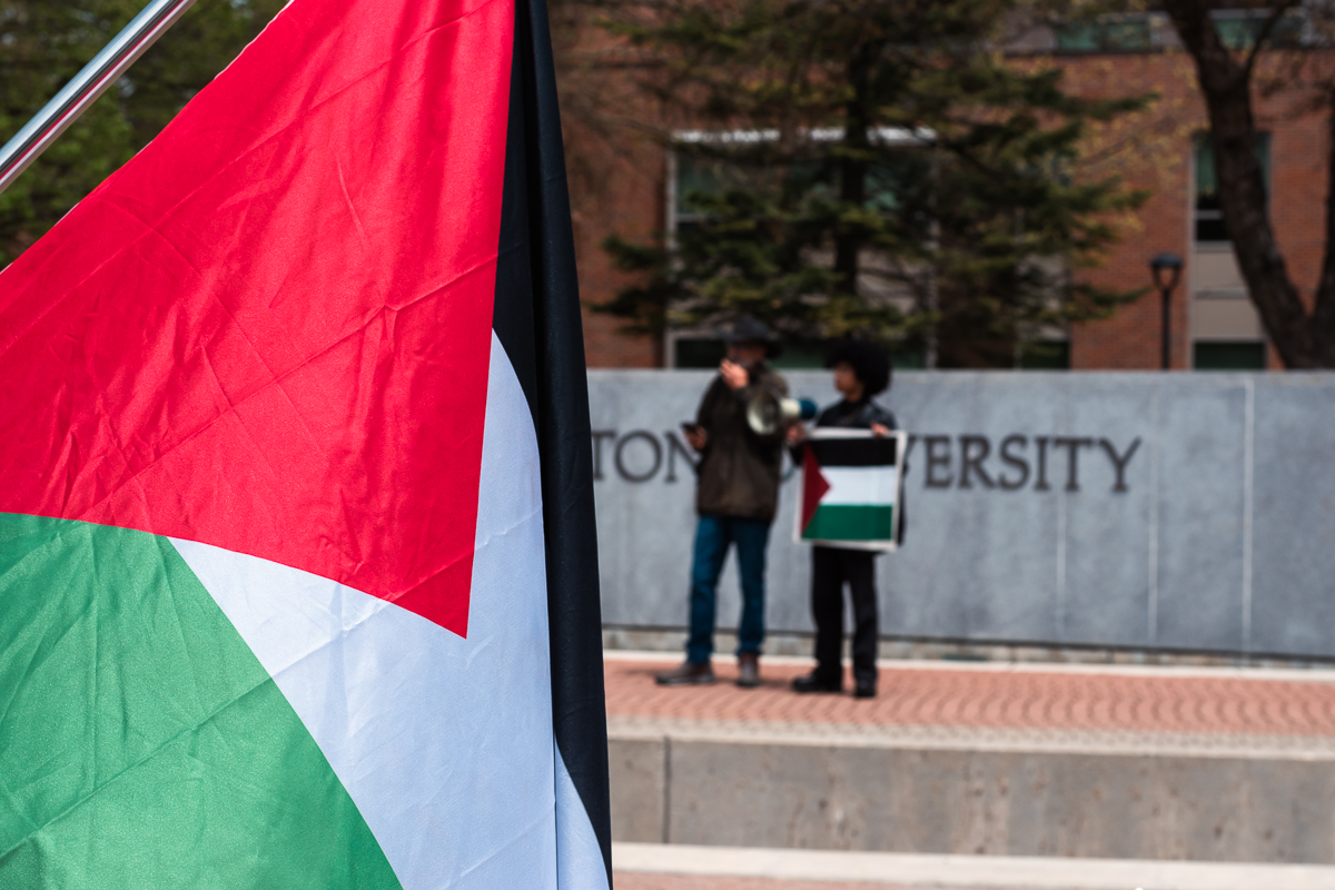 On+May+8%2C+Eastern+Washington+University+students+and+alumni+gathered+on+campus+holding+Palestinian+flags+and+signs%2C+calling+for+the+university+to+disinvest+from+its+partnership+with+Fairchild+Air+Force+Base.+