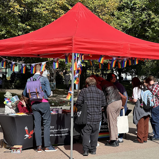 Students surrounding the Eagle Pride booth during Pride Kickoff on Oct. 3.