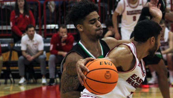 Guard Nic McClain posts up North Dakota guard Reggie Thomas on Dec. 4.