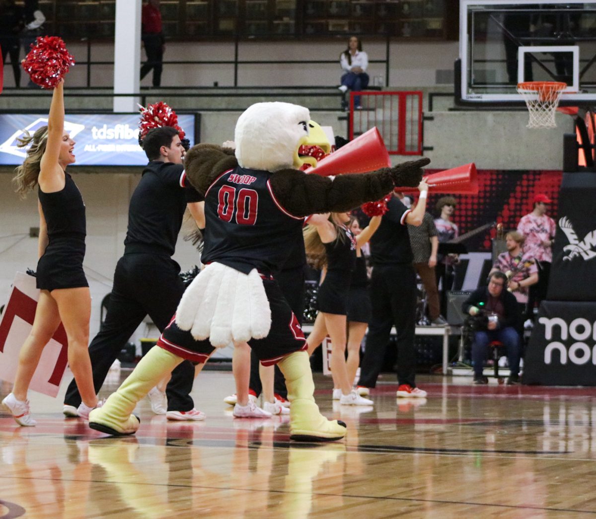 EWU mascot Swoop dances with the Eagle cheerleaders during a timeout in Eastern Washington’s game against Northern Arizona on Jan. 23.