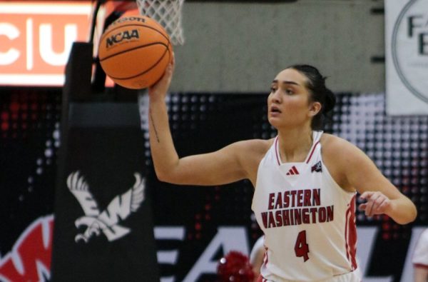 Graduate student Rachel Harvey makes a one-handed pass against Sacramento State on Jan. 11.