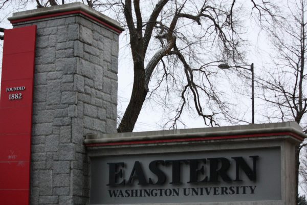 An Eastern Washington University sign and pillar marked with the founding year is located on the south side of campus.