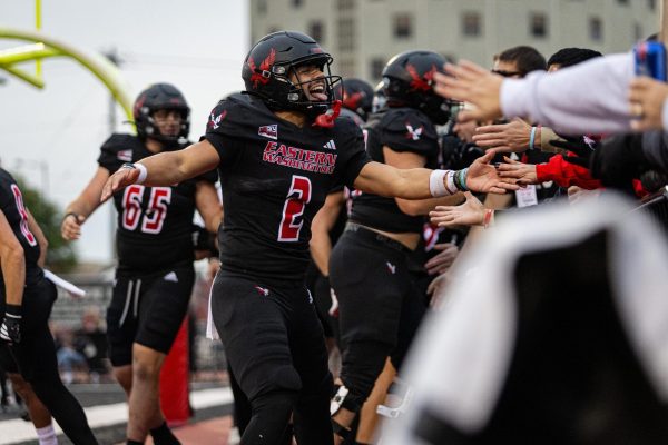 EWU sophomore quarterback Nate Bell celebrates a touchdown pass with fans during a game against Idaho on Oct. 18