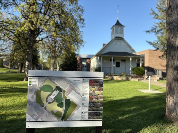 A sign in front of the Schoolhouse diagrams the lawn, providing a visual of the future landscape.