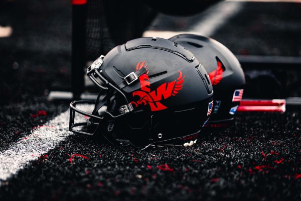 A pair of Eastern Washington University football helmets on the sideline of a game against Idaho on Oct. 18, 2025.