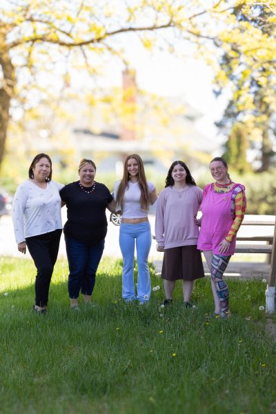 Native American Student Coalition board and advisors stand outside of the American Indian Education Center located at 706 5th Street Cheney WA, 99004.